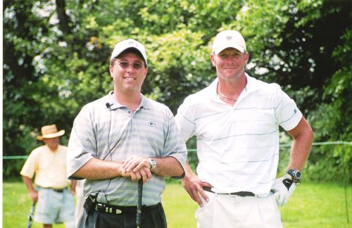 Jason Abraham pictured with Brett Farve on the golf course