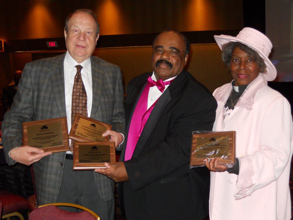 Attorney Micheal F. Hupy accepting community service awards